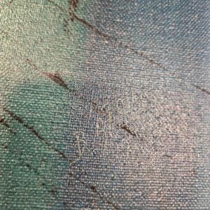 Close-up of an abstract cityscape painting showcasing vibrant brushstrokes and modern architectural details in gold and deep blue tones.