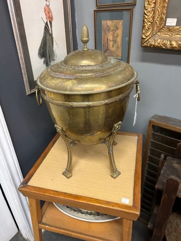 A rare 19th-century brass coal bin with stunning craftsmanship, perfect for collectors and antique décor enthusiasts.