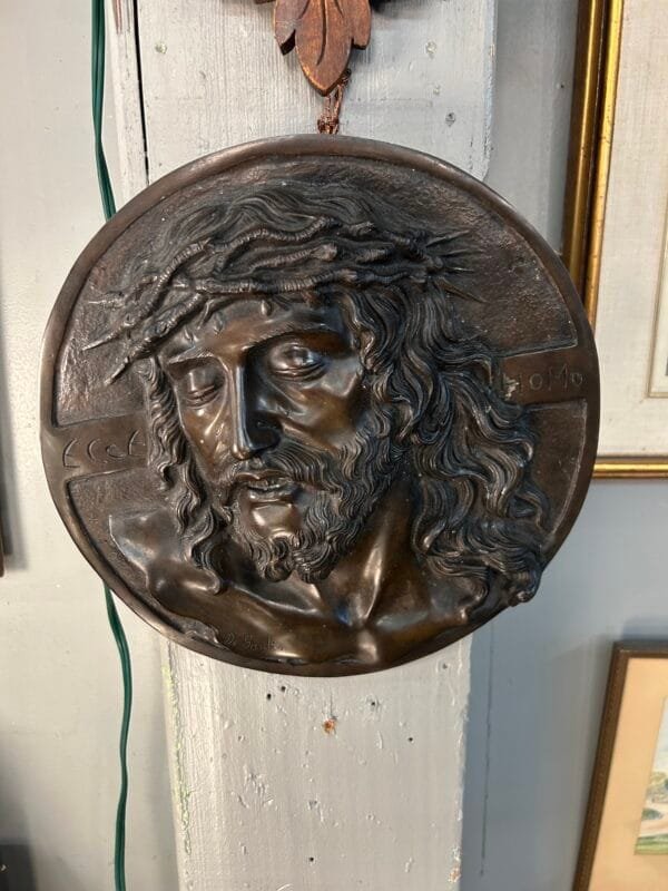 A signed antique bronze religious plaque with intricate detailing and historical significance. A collector’s dream for religious art and sacred décor.