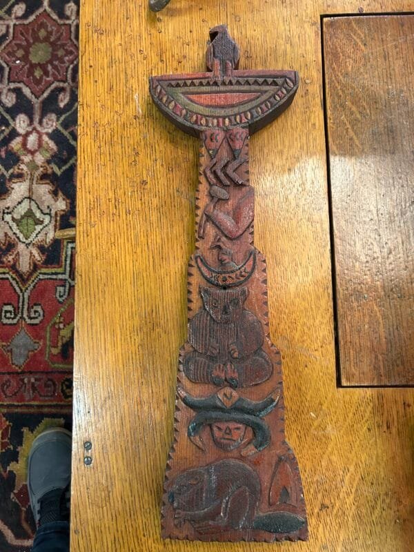 Rare hand-carved cedar totem featuring an eagle with a historic repair. Stunning folk art collectible for rustic and cultural décor.